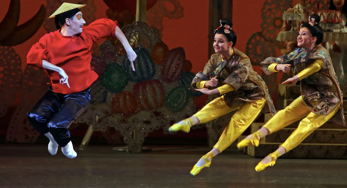 The old look at City Ballet, in 2015, with its pointy fingers, rice paddy hat and Fu Manchu mustache for the man and geisha wigs for the women. From left, Mr. Ippolito, Claire Von Enck and Baily Jones.Credit...Andrea Mohin/The New York Times