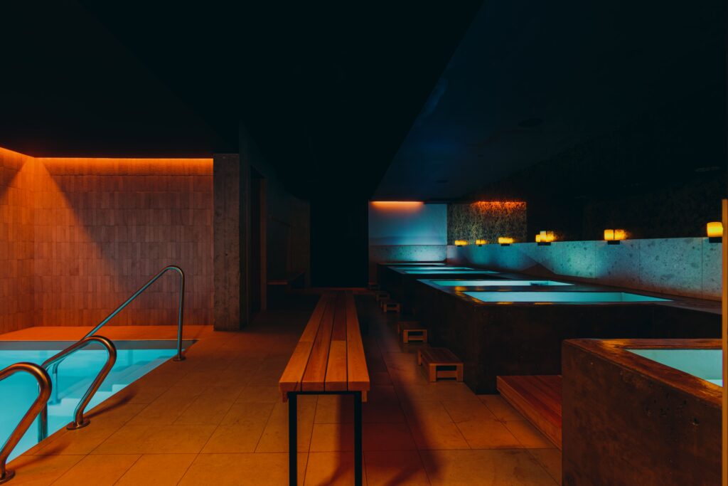 The cold baths at Joy. The orange and turquoise lighting is one of the strongest architectural images. Best Kept MTL