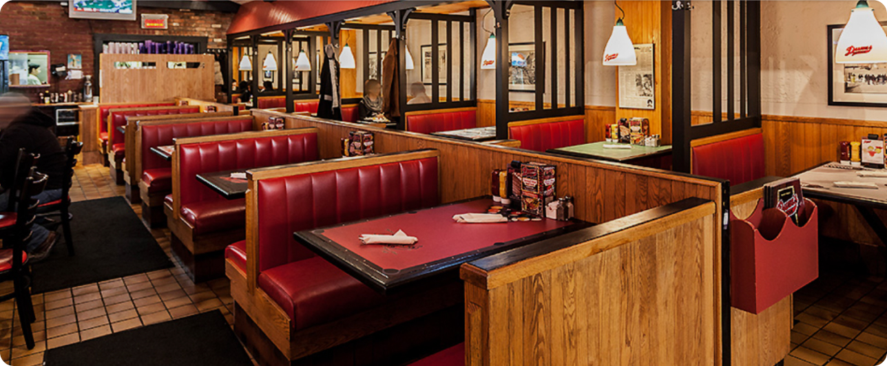 Red booths at Dunn’s Famous Downtown, a late lunch Montreal option
