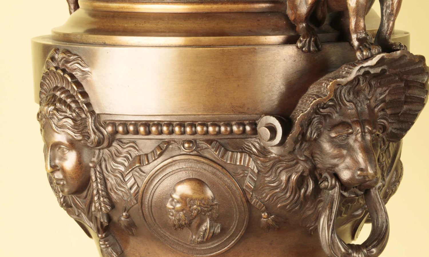 Decorative bronze with sculpted faces from Grand Central