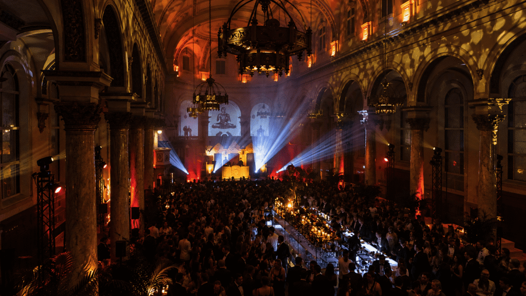 Spectacular overhead view of the venue, packed with guests and illuminated by stage lights.